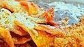 Chilaquiles · Fried tortillas, salsa (red or green) fresh cheese, two eggs, onions with rice and beans tor...