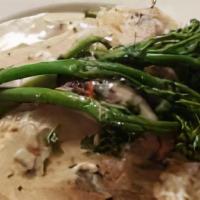 Chicken Marsala · Two chicken breast served with mash potatoes and seasonal vegetables covered in a mushroom b...