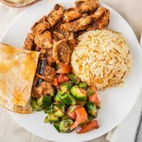 Chicken Kabab · Grilled chicken kabab wrapped in pita bread, pickles, Mediterranean salad, hummus, and tahin...