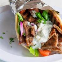 Gyros Sandwich · Beef and Lamb meat on a Pita bread topped with lettuce, tomatoes, red onion, and Tzatziki sa...