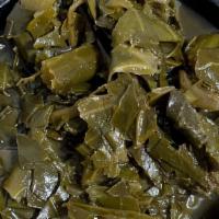 Collard Greens · Slow simmered fresh collard greens with our housemade creole seasoning.