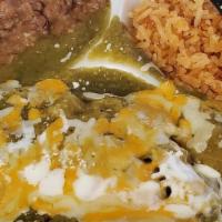 Enchiladas De Pollo · 3 Chicken Enchiladas with your choice of Red or Green Sauce, Topped with Cheese