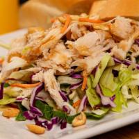 Chinese Chicken Salad · Shredded chicken, lettuce, carrots, red cabbage and peanuts tossed in soy-sesame vinaigrette.
