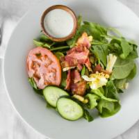 Spinach Salad · Fresh spinach, chopped bacon, chopped eggs, cucumbers, and tomato with Dill Dressing (may su...