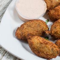 Jalapeño Shrimp Poppers · Eight mouth-watering poppers stuffed with shrimp and cream cheese. Chipotle ranch sauce.