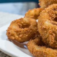 Panko Crusted Onion Rings · Hand cut onion rings with ranch dressing.