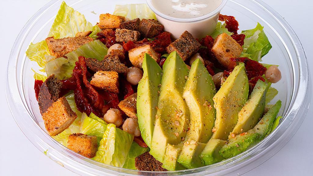 8A) Chickpea Caesar Salad In A Bowl · Chickpeas with romaine lettuce, sun-dried tomatoes, avocado slices and seasoned gluten free croutons with house Caesar dressing  served in a bowl.