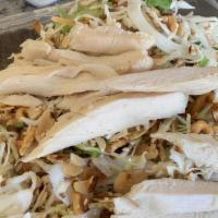 Chinese Chicken Salad · Chicken breast, shredded cabbage, carrot, lettuce almonds, crispy noodles, and house sesame ...