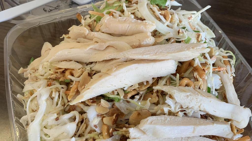 Chinese Chicken Salad · Chicken breast, shredded cabbage, carrot, lettuce almonds, crispy noodles, and house sesame seed dressing.