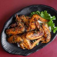 Sweet & Spicy Teba · Fried chicken wings drizzled with our sweet and spicy sauce