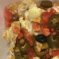 Regular Nachos · Our chips covered with beans, Monterey jack cheese, jalapeños and tomatoes.