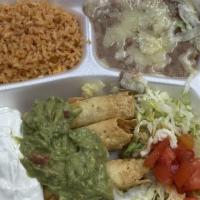 Flautas Mexicana · Three rolled beef, chicken or cheese taquitos, fried crisp and topped with guacamole and sou...