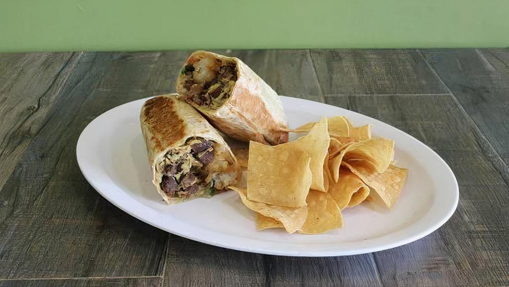 Breakfast Burrito · Voted as one of the best breakfast burrito in LA by eater LA! Scrambled eggs, Jack cheese, breakfast potatoes, bacon, pico de gallo, choice of pinto or black beans.