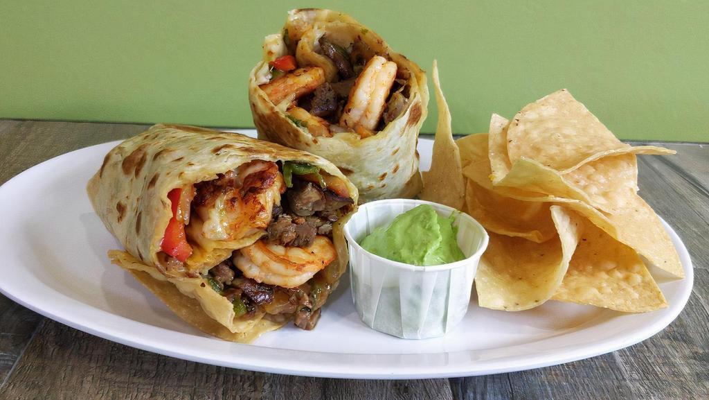 Surf N’ Turf Burrito · One of our most popular burritos! Marinated angus steak and shrimp, poblano peppers-caramelized onions, chimichurri crema, served with side of chips, salsa & guacamole.