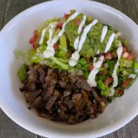 Carnitas Burrito Bowl · Slow cooked shredded pork, rice, jack cheese, salsa and, lettuce choice of pinto or black be...