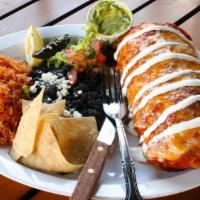 Macho Wet Burrito · GIANT wet burrito smothered in our red or green sauce, topped with sour cream & melted jack ...
