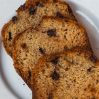 Chocolate Chunk Banana Bread · A thick slice of soft and delicious fresh-baked banana bread with chocolate chips and a brow...
