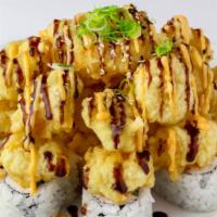 Popcorn Shrimp Roll · Crab and avocado (In). Popcorn shrimp with orange sauce and eel sauce (Top).
