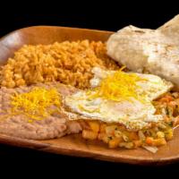 Huevos Rancheros · Served with two eggs, rice, beans and pico de gallo.