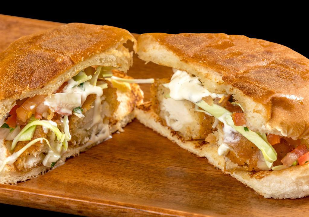 Fish Torta · Breaded fish, tartar sauce, cabbage, and pico de gallo.