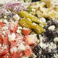 Greek Salad · Romaine lettuce, feta cheese, kalamata olives, cherry tomatoes, artichoke hearts, red onions