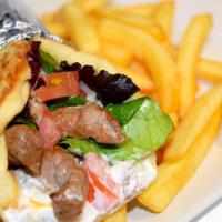 Tri-Pita · Certified Angus Beef Tri-Tip, mixed greens, tomatoes, onions, garlic lebni mix, wrapped in a...