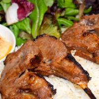 Lamb Chop Plate · 4 pieces of New Zealand, French cut lamb chops, rice, house mix, house salad, 1 side.