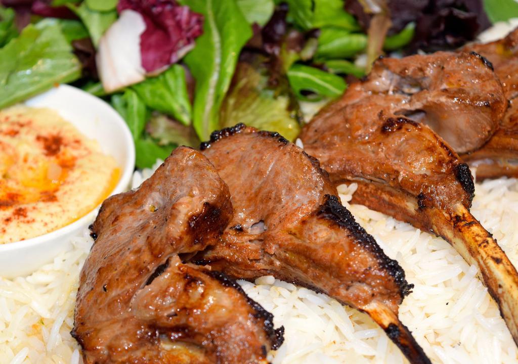 Lamb Chop Plate · 4 pieces of New Zealand, French cut lamb chops, rice, house mix, house salad, 1 side.
