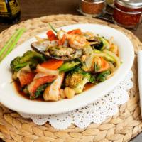 Spicy Seafood · Sauteed mixed seafood with chili-garlic, basil leaves, onions and bell peppers.