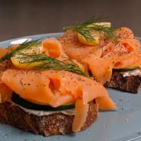 Rule 34 · Toast with smoked salmon, cream cheese, cucumbers, dill, lemon, and pickled red onion