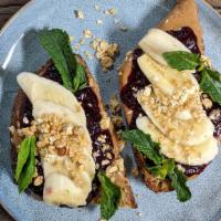 Power Button · Toast with almond butter, house berry chia jam, fresh bananas, granola, and fresh mints