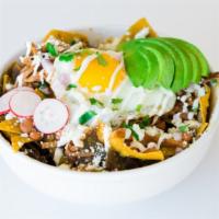 Chilaquiles · Home made yellow corn tortilla chips, red or green salsa, onions, sour cream, queso fresco a...