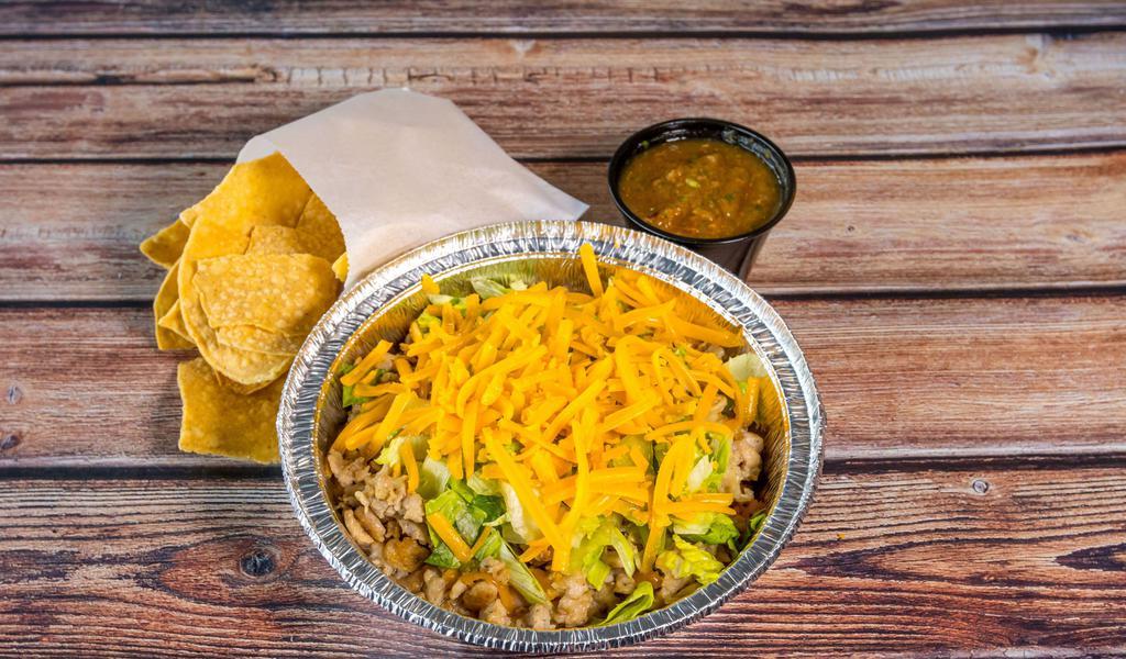 Burrito Bowl · Served in a bowl with grilled protein, your choice of rice & beans, salsa especial, lettuce, cheese & tortilla chips with salsa fresca.
