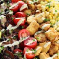 Veggie Salad With Vegan Cheese · Romaine lettuce, tomato, corn, garbanzo, kidney, zucchini, and vegan cheese with Italian dre...