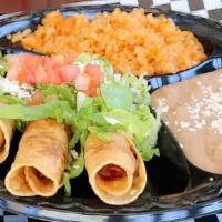 Potato Taquitos · 3 rolled taquitos with sour cream, queso fresco, lettuce, tomato, aguasauce and cotija cheese.