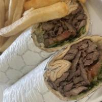 Beef Shawarma · Served with our signature sauce in lavash bread,lettuce,tomato,cucumber pickles