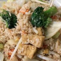 Fried Rice Vegetable & Tofu · Stir-fried jasmine steamed rice with egg, onions, peas, and carrots with fried tofu and asso...