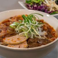 Bun Bo Hue Soup · Traditional Vietnamese simmered beef soup, vermicelli, tendons, beef, and meatloaf.