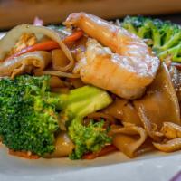 Pad See You · Wok fried flat rice noodles with sweet soy sauce, eggs, broccoli, and carrots.