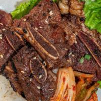 Galbi (Korean Grilled Short Ribs) · The ribs are marinated in a sauce made from Korean pear juice, rice wine, soy sauce, garlic,...