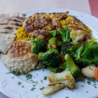 Mediterranean Chicken Kabob · Served with: Rice Pilaf, Hummus, Cucumber Salad, and Pita