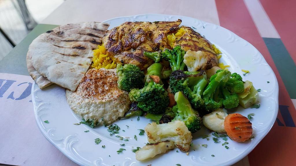Mediterranean Chicken Kabob · Served with: Rice Pilaf, Hummus, Cucumber Salad, and Pita