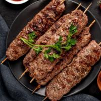 Rack Of Lamb · Lamb chops marinated in herbs and spices. Cooked artfully on a skewer.