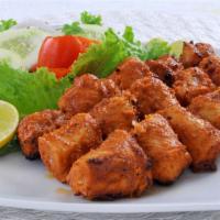 Halal Chicken Tikka · Delectable, boneless chicken pieces marinated in herbs and spices. Roasted tandoori style wi...
