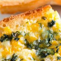Cheesy Garlic Bread · Hot and cheesy, three-cheese garlic blend spread over a French loaf and baked to perfection,...