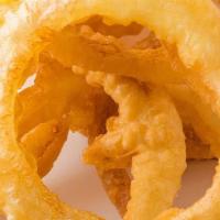 Onion Rings · Bring the crunch with these golden fried, breaded, crumb-coated onion rings, served with ran...