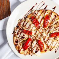 Chicken & Brie Flatbread · Grilled chicken, crisp apples, oven-roasted tomatoes, creamy brie cheese and A balsamic glaz...