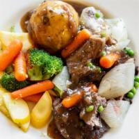 Braised & Slow-Roasted Pot Roast · Tender chunks of chuck roast slow-simmered for full flavor and tenderness, topped with mushr...