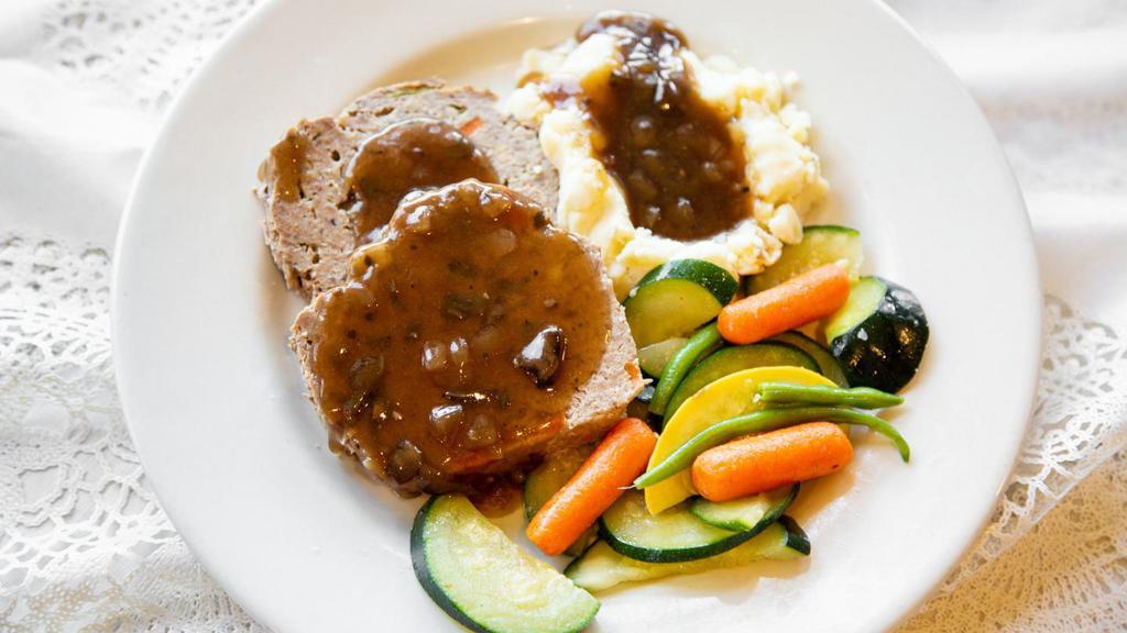 Marie'S Meatloaf · Slow -baked with 100% Angus ground beef, onions, green peppers, carrots and special seasonings, topped with mushroom cabernet gravy. Served with fresh mashed potatoes and fresh seasonal vegetables.