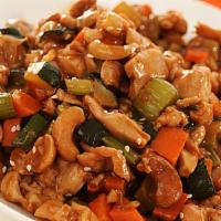 Cashew Chicken · Sliced white meat chicken with zucchini, carrots, and celery stir-fried in brown sauce toppe...